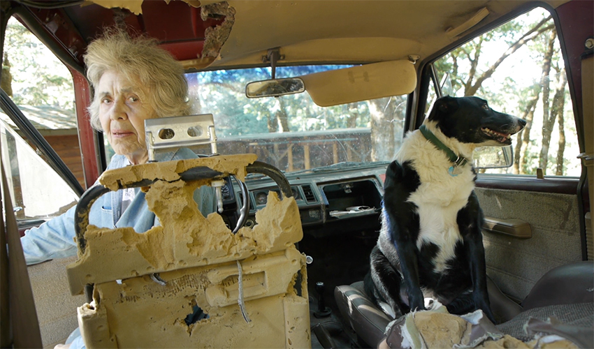 Sally Geahart in jeep in scene from A Great Ride